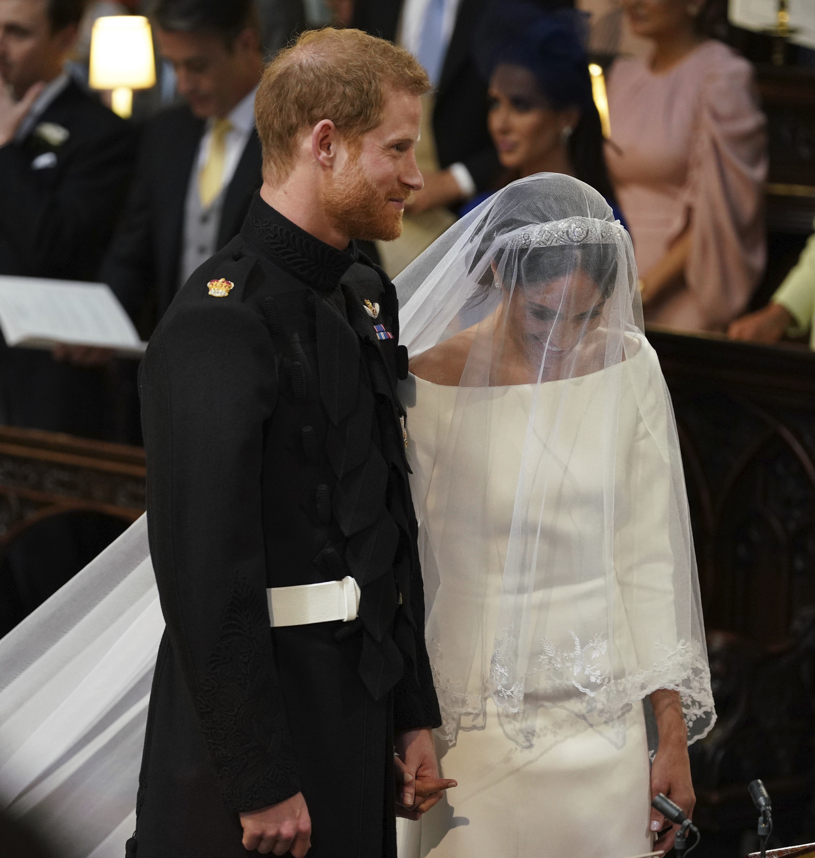 Harry y Meghan tuvieron muchos momentos de complicidad durante la boda que se reflejan en sus gestos y miradas. (Fotos: AP)