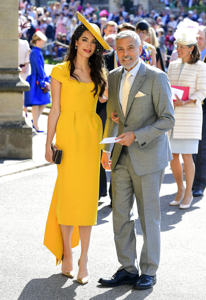 Amal y George Clooney, entre los invitados a la boda de Meghan y Harry. Ella fue una de las invitadas mejor vestida con una pieza de Stella McCartney. (Foto: AP)