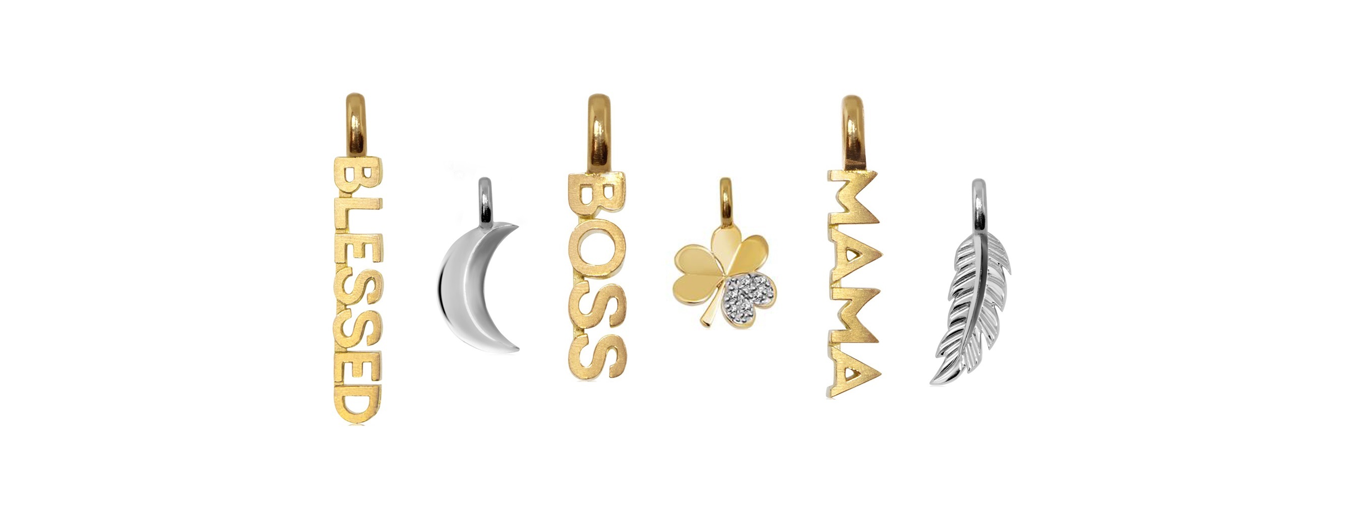 Dijes con palabras y símbolos de Alex Woo, disponibles en Reinhold Jewelers.